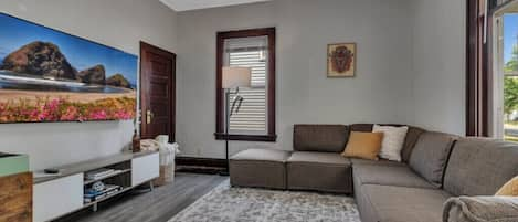 cozy living room with a huge flat screen tv and a record player