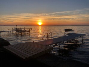 Enjoy beautiful sunsets from the backyard or dock