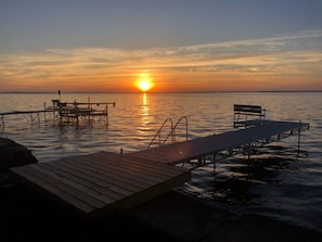 Enjoy beautiful sunsets from the backyard or dock