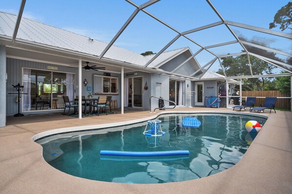 oversized salt heated pool with plenty of pool toys and floaties