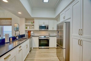 Kitchen with granite counters, stainless steel appliances & all the goods!