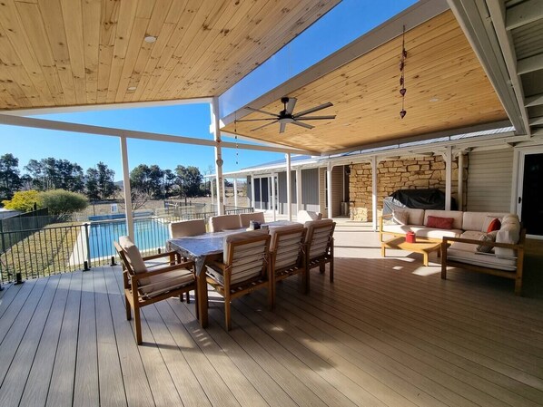 The outdoor area has a BBQ perfect for summer nights. Enjoy dining outside under cover with a breezy ceiling fan. 
