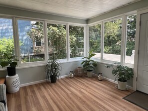 Beautiful sunroom for tranquil morning coffee