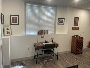 One of two entry doors and a work/study area.