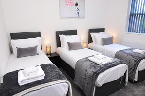 This room offers the flexibility of three single beds that can be easily converted into a king-size bed. Please let us know in advance if you'd like to make this arrangement.