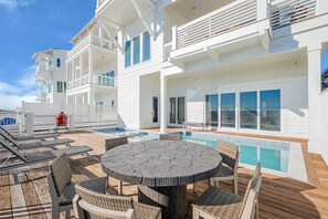 Pool area with pool loungers and table