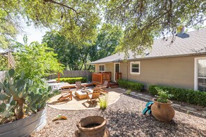 River Haus Outdoor Area Featuring a Hot Tub and Firepit
