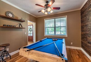 Unwind in our pool room, where you can reclaim victory after a tough day on the greens.
