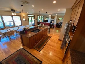 Well equipped kitchen is connected to living areas of the home