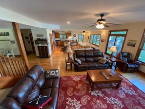 Large main floor living room. Adjacent to kitchen/dining, lake-side Fireplace