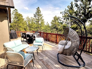 dock with dining table, sitting area and swing