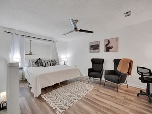 Master bedroom on the third floor, with king-size bed and dedicated work space!