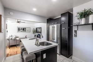 Fully stocked kitchen with full sized appliances--Fridge, Stove/oven, dishwasher