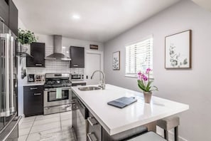 Fully stocked kitchen with full sized appliances--Fridge, Stove/oven, dishwasher