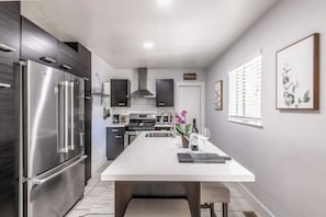 Fully stocked kitchen with full sized appliances--Fridge, Stove/oven, dishwasher