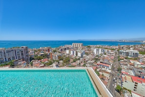 Infinity rooftop pool overlooking the city and ocean