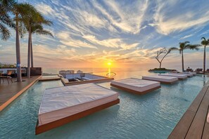 Sun beds on rooftop pool