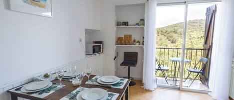 Dinner Table and Kitchenette - Balcony with River and Vineyard View