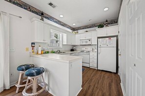 The kitchen counter provides additional space for serving snacks or meals