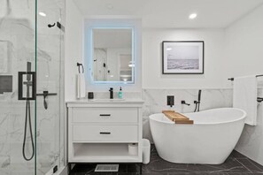 Soak away stress in this luxurious, custom bathroom