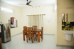 First Floor Dining area with refrigerator 