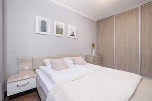 A bright, bedroom with a comfortable double bed that invites you to relax and unwind.