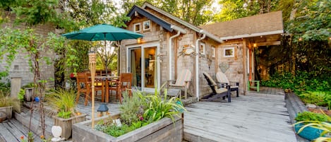 Front of home with large deck and seating area