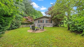 Fire pit and picnic area surrounded by beauty