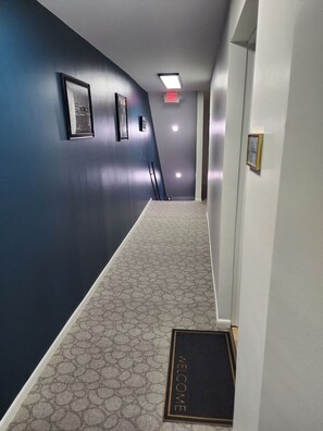 Interior hallway to access loft. The hallway is lined with historical pictures of Marion. A treat for your eyes and mind, this hallway is a ode to history and what inspired the name of the property.