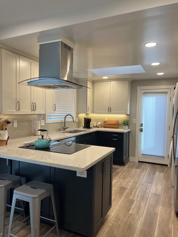 Full kitchen with washer and dryer 