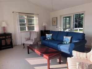 Light and spacious living room with sliding doors out to the deck.
