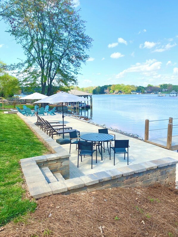 Lakeside patio with beach beyond