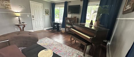 Enjoy the comfortable living room with the baby grand!