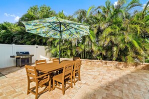 Fire up the grill and enjoy good food and great company under the shade of tropical palms.