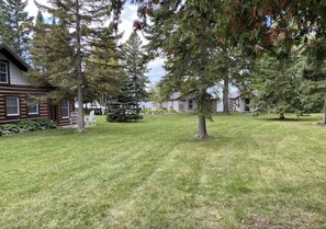 Three cabins with shared green space