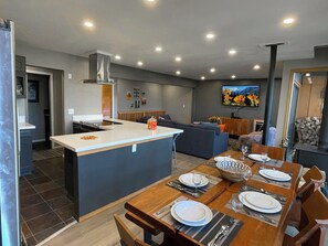Beautiful wood table with live edges, hardwood floors for easy clean up. 