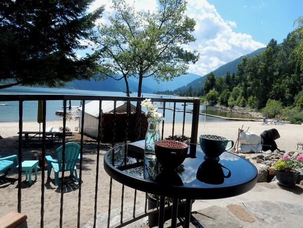 Patio with table facing lake