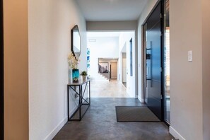 Main entrance and foyer, straight ahead view of the right wing of the home