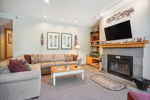 Beautifully decorated living room, your home away from home.  Cheery atmosphere and dont forget the wood burning fireplace!