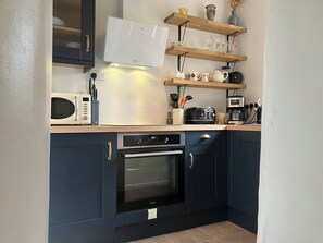 Fully fitted kitchen including dishwasher, oven and electric hob.
