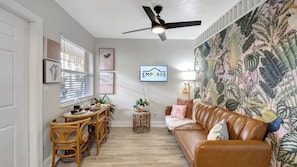 Step into the chic embrace of our Coconut Grove Tropical Haven themed living area.