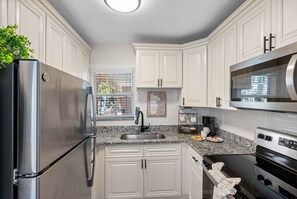 Embark on a culinary adventure in the heart of Seaside Serenity's fully functional complete kitchen.