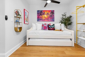 And for those looking for a shared coastal experience, Seaside Serenity has a common space adorned with a twin-size bed and a trundle for additional sleeping quarters.