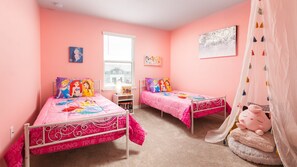 Kids will love the upstairs bedroom with a lovely Disney princess theme