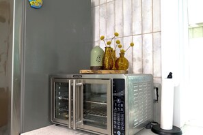 Countertop oven it’s smaller, but can fit medium size pizza