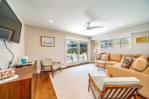 Large comfortable family room overlooking pool at back of house