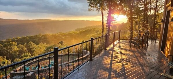 Summer sunset, wrap-around deck goes across the entire back of the 
house.
