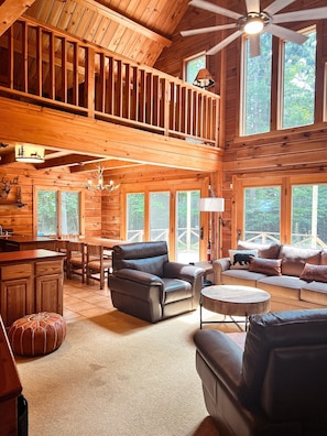 There is flow between the Living Room, Kitchen, and Dining Room - with access to the back deck and yard.