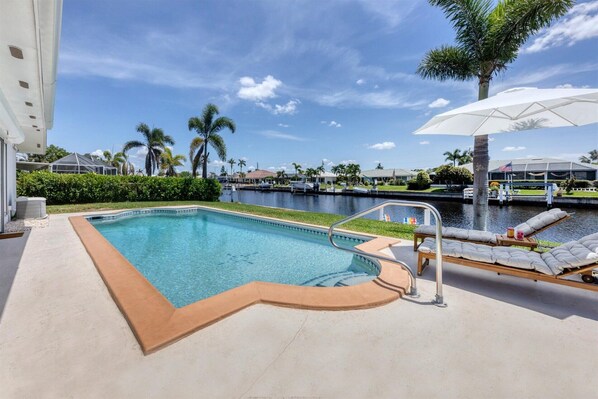 Pool and deck overlook the canal