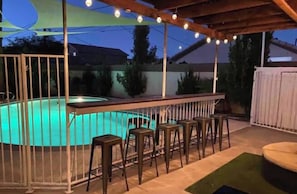 Pool with bar and shaded seating area
